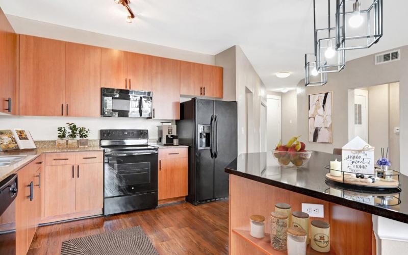 a kitchen with wooden cabinets