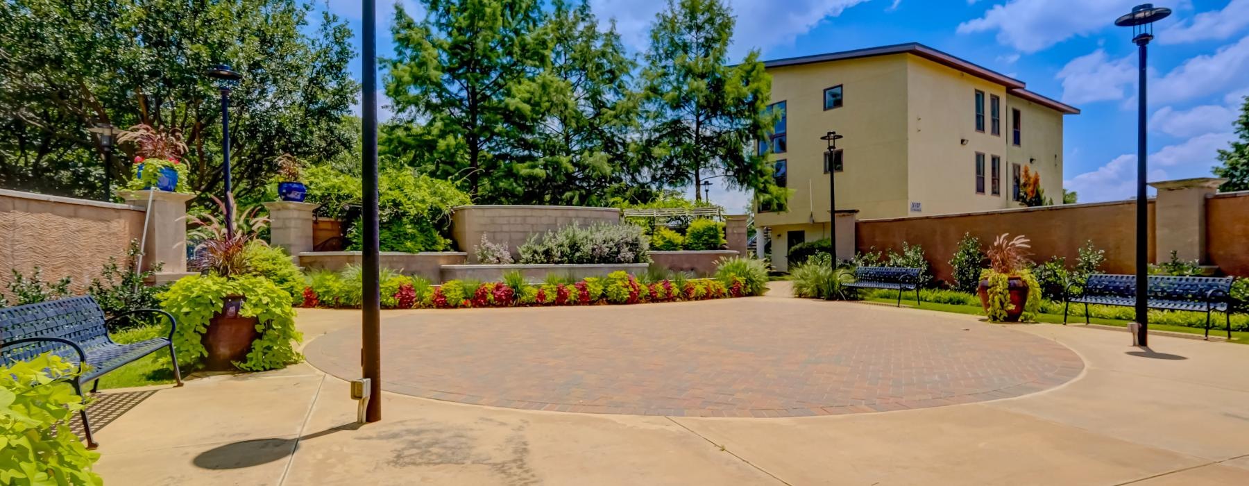 a paved area with a building in the background