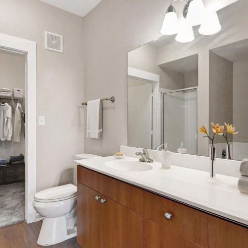 Bathroom options with thoughtful details a bathroom with a large mirror