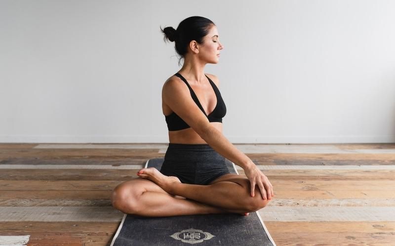 woman stretching on a yoga mat