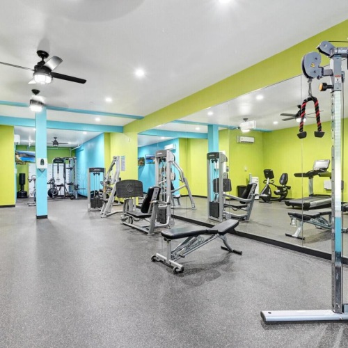 State-of-the-art amenities a gym with exercise equipment